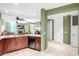 Open kitchen with breakfast bar and view into living room at 120 E Rio Salado Pkwy # 201, Tempe, AZ 85281