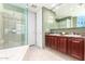 Double vanity bathroom with granite countertop and a glass shower at 120 E Rio Salado Pkwy # 201, Tempe, AZ 85281