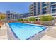Resort-style pool with plenty of lounge chairs at 120 E Rio Salado Pkwy # 201, Tempe, AZ 85281