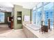 Spa-like bathroom with a large soaking tub and city views at 120 E Rio Salado Pkwy # 201, Tempe, AZ 85281