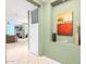 View of living room from entryway with artwork and tile floor at 120 E Rio Salado Pkwy # 201, Tempe, AZ 85281