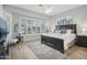 Main bedroom with a king-size bed, large windows, and ceiling fan at 13518 W Sola Dr, Sun City West, AZ 85375