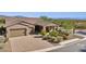 Single-story home with desert landscaping and two-car garage at 17662 E Blaze Ln, Rio Verde, AZ 85263