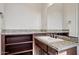 Bathroom with granite countertop and dark cabinets at 17662 E Blaze Ln, Rio Verde, AZ 85263