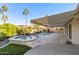 Luxury pool and spa with striped retractable awning at 25418 S Spring Creek Rd, Sun Lakes, AZ 85248