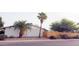 Bright white home with a palm tree and gravel landscaping at 520 N Santa Barbara St, Mesa, AZ 85201