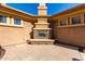 Outdoor stone fireplace in a private courtyard setting at 2634 N 141St Ln, Goodyear, AZ 85395