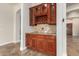 Built-in wet bar with wine rack and granite countertop at 2634 N 141St Ln, Goodyear, AZ 85395