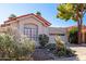 Single-story home with red tile roof, cacti, and desert landscaping at 11291 E Jenan Dr, Scottsdale, AZ 85259