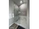 Walk-in shower with glass enclosure and marble tile at 11291 E Jenan Dr, Scottsdale, AZ 85259