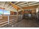Empty horse stall with wooden walls and dirt floor at 4331 W Port Au Prince Ln, Glendale, AZ 85306