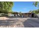 View of barn with several stalls and surrounding grounds at 4331 W Port Au Prince Ln, Glendale, AZ 85306