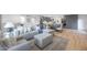 Open living area featuring a comfortable sectional sofa and light gray color scheme at 4331 W Port Au Prince Ln, Glendale, AZ 85306