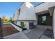 Modern home's entrance with a water fountain and dark door at 4331 W Port Au Prince Ln, Glendale, AZ 85306