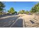 Expansive riding arena with a view of the barn at 4331 W Port Au Prince Ln, Glendale, AZ 85306