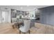 Modern kitchen with gray cabinets, island, and stainless steel appliances at 4331 W Port Au Prince Ln, Glendale, AZ 85306