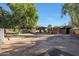 View of barn with several stalls and surrounding grounds at 4331 W Port Au Prince Ln, Glendale, AZ 85306