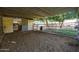 Empty horse stall with metal roof and dirt floor at 4331 W Port Au Prince Ln, Glendale, AZ 85306