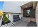 Modern home's entrance with a water fountain and dark door at 4331 W Port Au Prince Ln, Glendale, AZ 85306