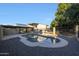 Inviting kidney-shaped pool surrounded by gravel at 4331 W Port Au Prince Ln, Glendale, AZ 85306