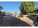 Large backyard with dirt ground and chain link fence at 4331 W Port Au Prince Ln, Glendale, AZ 85306
