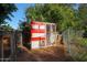 Red chicken coop with attached run in fenced backyard at 4331 W Port Au Prince Ln, Glendale, AZ 85306