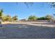 Large riding arena with horses and a view of the barn at 4331 W Port Au Prince Ln, Glendale, AZ 85306