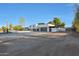 Front view of the house showcasing the driveway and landscaping at 4331 W Port Au Prince Ln, Glendale, AZ 85306