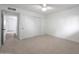 Bright bedroom with ceiling fan and access to hallway at 4331 W Port Au Prince Ln, Glendale, AZ 85306