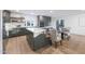 Modern kitchen with gray cabinets, white countertops, and breakfast nook at 4331 W Port Au Prince Ln, Glendale, AZ 85306