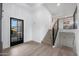 Bright entryway with stairs, hardwood floors, and modern door at 4331 W Port Au Prince Ln, Glendale, AZ 85306