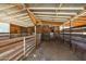 Empty horse stall with wooden walls and dirt floor at 4331 W Port Au Prince Ln, Glendale, AZ 85306