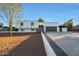 Modern home exterior with a two-car garage and clean lines at 4331 W Port Au Prince Ln, Glendale, AZ 85306