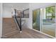 Modern staircase with wood and metal accents leading to upper level at 4331 W Port Au Prince Ln, Glendale, AZ 85306