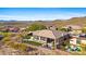 Aerial view of a house with a backyard and pool, mountain views in background at 2549 W Shinnecock Way, Anthem, AZ 85086