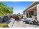 Backyard with lounge chairs, fire pit and putting green at 2549 W Shinnecock Way, Anthem, AZ 85086