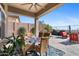 Covered patio with seating area, perfect for outdoor dining at 2549 W Shinnecock Way, Anthem, AZ 85086