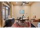 Home office with a large desk and comfortable seating at 2549 W Shinnecock Way, Anthem, AZ 85086
