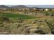 Golf course view with desert vegetation and distant homes at 2549 W Shinnecock Way, Anthem, AZ 85086