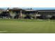 Community clubhouse with golf course views and putting green at 2549 W Shinnecock Way, Anthem, AZ 85086