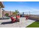 Relaxing backyard patio with fire pit, seating area, and mountain views at 2549 W Shinnecock Way, Anthem, AZ 85086