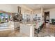 Gourmet kitchen boasts expansive island, stainless steel appliances, and granite countertops at 2549 W Shinnecock Way, Anthem, AZ 85086