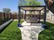 Modern hot tub with pergola cover in a beautifully landscaped backyard at 2549 W Shinnecock Way, Anthem, AZ 85086