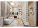 Luxurious bathroom with a soaking tub, walk-in shower, and double vanity at 2549 W Shinnecock Way, Anthem, AZ 85086