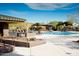 Resort-style pool with lounge chairs and shaded seating at 2549 W Shinnecock Way, Anthem, AZ 85086