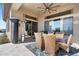 Covered patio with seating area and access to the house at 2549 W Shinnecock Way, Anthem, AZ 85086