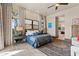 Bright bedroom with a large bed, ensuite bathroom access, and plenty of natural light at 2549 W Shinnecock Way, Anthem, AZ 85086