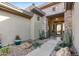 Inviting front entry with stone accents and landscaped walkway at 2549 W Shinnecock Way, Anthem, AZ 85086