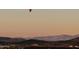 Hot air balloon over mountain and city views at 2549 W Shinnecock Way, Anthem, AZ 85086