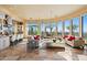 Open living room with large windows, high ceilings, and stunning views at 2549 W Shinnecock Way, Anthem, AZ 85086